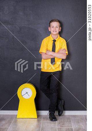 Cute handsome school boy in yellow t-shirt tie and Cute handsome school boy in yellow t-shirt tie and 31020553