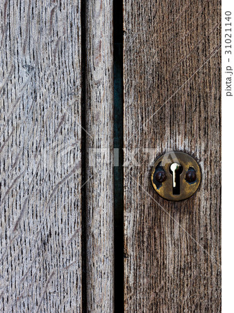 Old wooden door with metal lock close up texture Old wooden door with metal lock close up texture 31021140