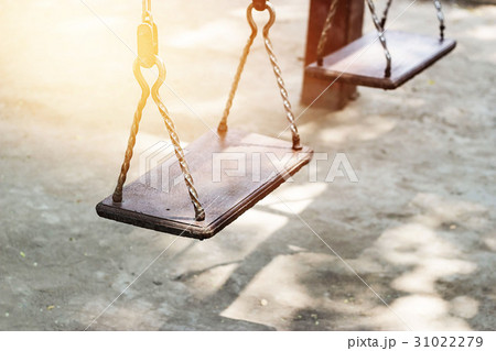 Empty metal swing in playground Empty metal swing in playground 31022279
