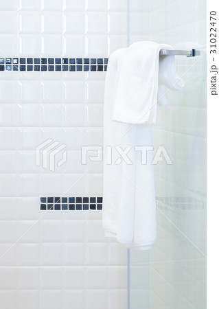 White towel hanging on towel rail 31022470
