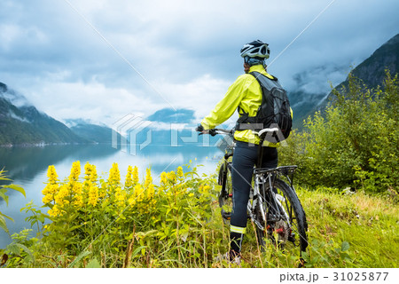 Mountain bike cyclist near fjord, Norway 31025877