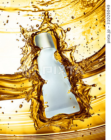 Cream bottle mock up in water splash of yellow 31026049
