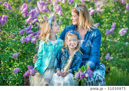 Mother woman with two cute smiling girls sisters Mother woman with two cute smiling girls sisters 31030975