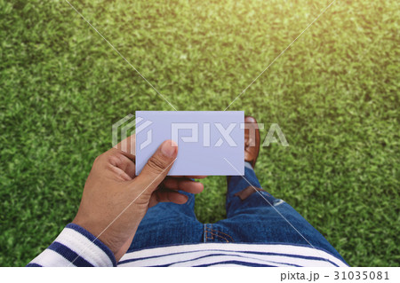 Blank business card on hand for mock up, Top view 31035081
