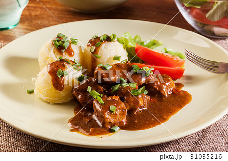 Goulash with boiled potatoes 31035216