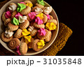 Bowl of iced gem biscuits on dark background 31035848