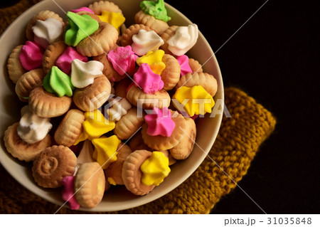 Bowl of iced gem biscuits on dark background 31035848