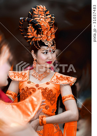 young beauty oriental girl in an orange 31037483