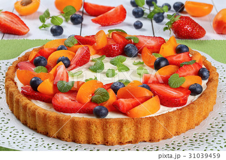 tart beautifully topped with fresh fruits 31039459