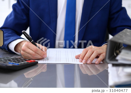Close up view of bookkeeper or financial inspector Close up view of bookkeeper or financial inspector 31040477