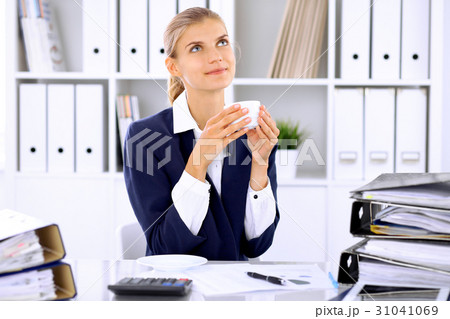 Happy business woman or female accountant having Happy business woman or female accountant having 31041069