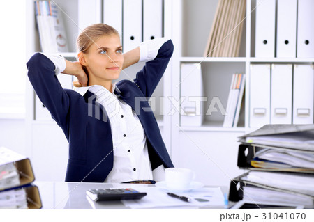 Happy business woman or female accountant having Happy business woman or female accountant having 31041070