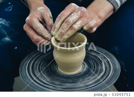 Creating vase of white clay close-up. Master crock Creating vase of white clay close-up. Master crock 31043751