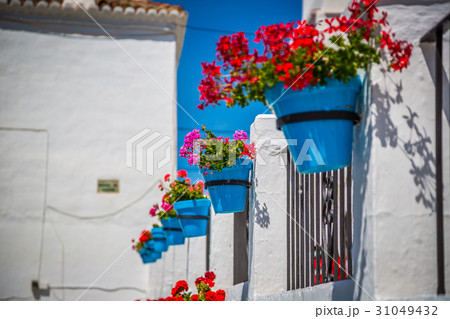Street with flowers in the Mijas town, Spain Street with flowers in the Mijas town, Spain 31049432