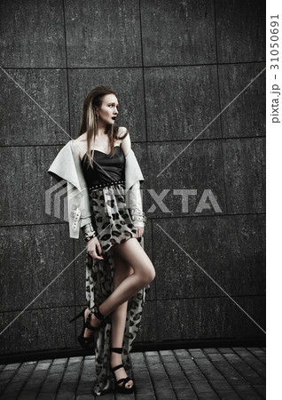 Young beautiful stylish girl posing in city.  31050691