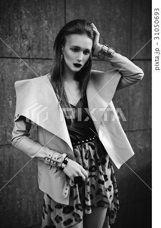 Young beautiful stylish girl posing in city.  31050693