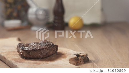 medium rib eye steak on board 31050899