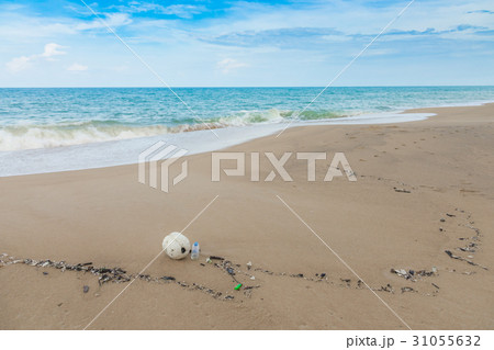 Plastic bottles and other waste on sea beach . Plastic bottles and other waste on sea beach . 31055632