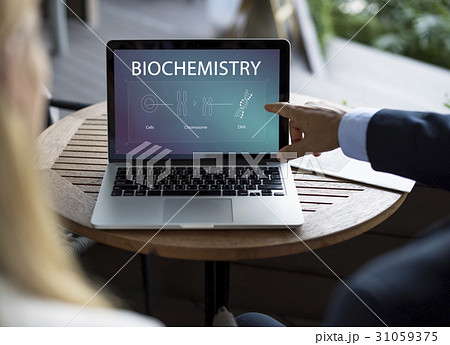 Business Man pointing at laptop with DNA icons Business Man pointing at laptop with DNA icons 31059375