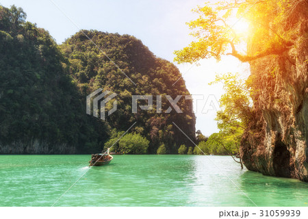 Clear sea with longtail boat at Phuket, Thailand. 31059939