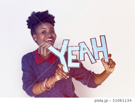 Smiling African Woman Holding Yeah Word 31061134