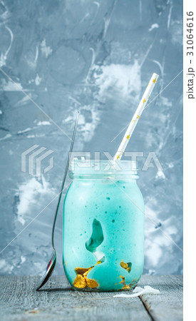 Blue tropical smoothie with coconut in a jar.  31064616