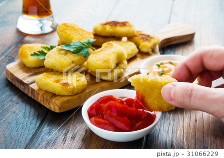 Portion of crisp chicken nuggets Portion of crisp chicken nuggets 31066229