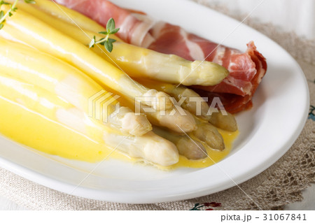 asparagus with Dutch sauce and prosciutto ham asparagus with Dutch sauce and prosciutto ham 31067841