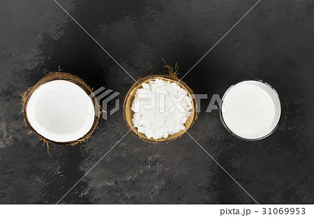 Vegan coconut milk in glass on a dark background 31069953