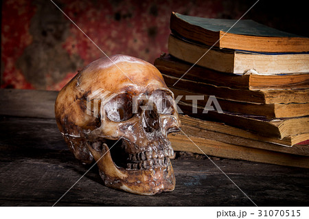 Still Life with a Skull and book on wooden table 31070515