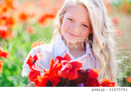Cute blonde child girl with bouquet of poppies Cute blonde child girl with bouquet of poppies 31070761