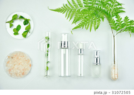 Cosmetic bottle containers with green herbal leave Cosmetic bottle containers with green herbal leave 31072505