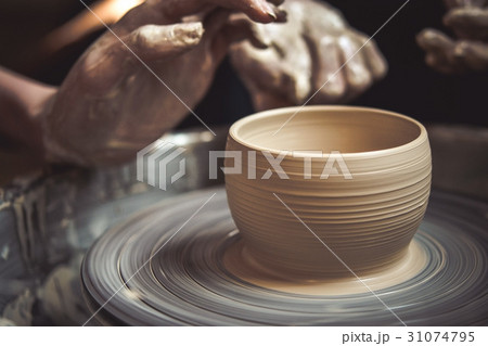Creating vase of white clay close-up. Master crock Creating vase of white clay close-up. Master crock 31074795