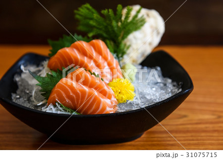 Fresh salmon sashimi on wooden table 31075715