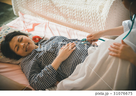 woman during pregnancy or shortly after childbirth 31076675