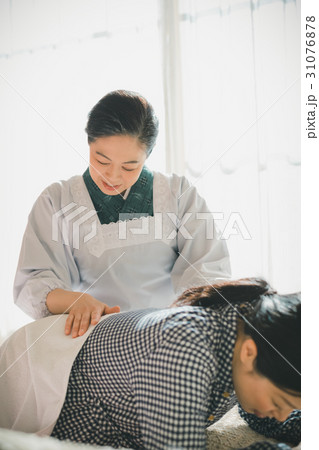 woman during pregnancy or shortly after childbirth 31076878