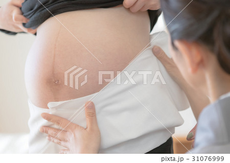 woman during pregnancy or shortly after childbirth woman during pregnancy or shortly after childbirth 31076999