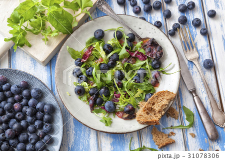 Healthy salad with rocket and blueberries Healthy salad with rocket and blueberries 31078306