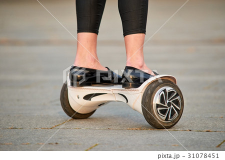 Legs on gyroscooter, close up. 31078451