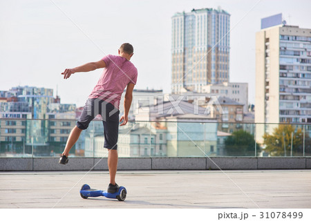 Single leg hoverboard ride. 31078499