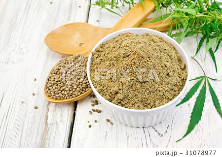 Flour hemp in bowl with spoons on board 31078977