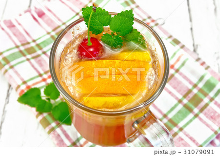 Lemonade with cherry and orange in wineglass 31079091