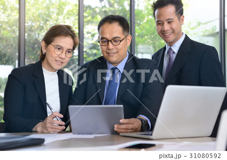 Business persons discussing and working together 31080592