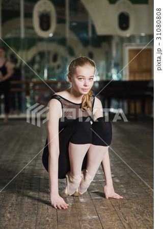 Woman sitting on her foot Woman sitting on her foot 31080808