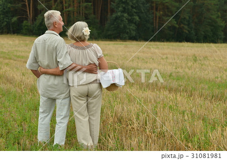 Senior couple on mowed field of wheat Senior couple on mowed field of wheat 31081981