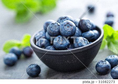 Fresh Blueberries in a bowl on dark background Fresh Blueberries in a bowl on dark background 31082273