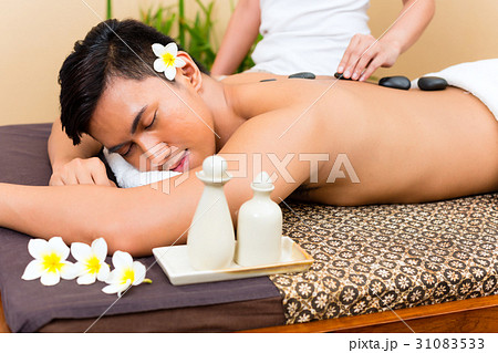 Indonesian man at hot stone wellness massage 31083533
