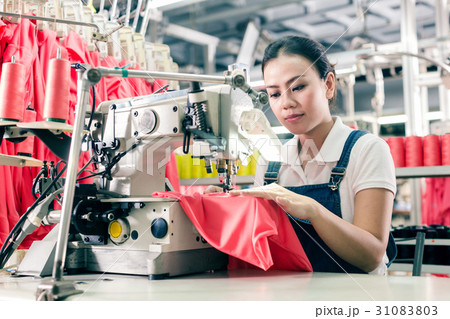 Chinese seamstress working in textile factory Chinese seamstress working in textile factory 31083803