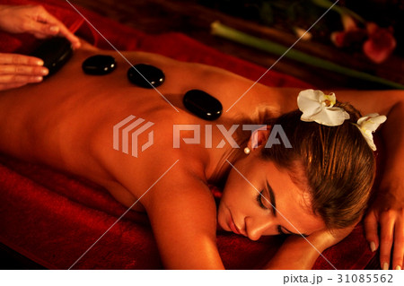 Hot stone therapy pack .Massage stones of woman in 31085562