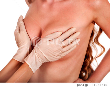 Female breast augmentation. Doctor hands wearing 31085640